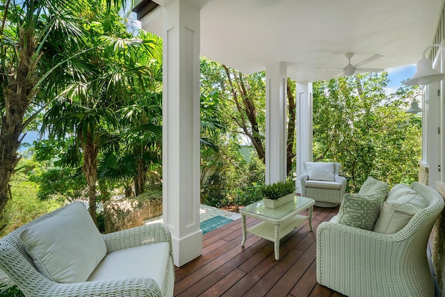 wooden terrace featuring ceiling fan