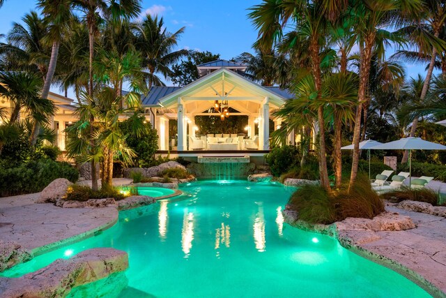 view of pool at dusk