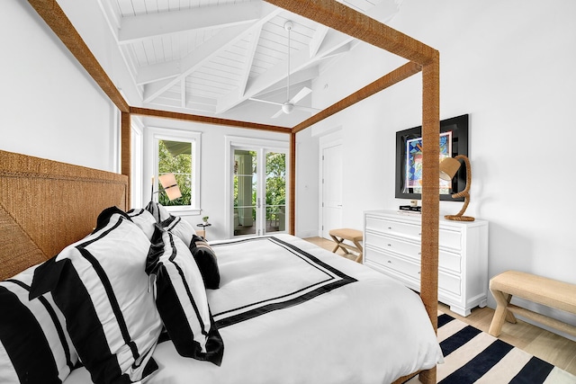 bedroom featuring light hardwood / wood-style floors and lofted ceiling with beams