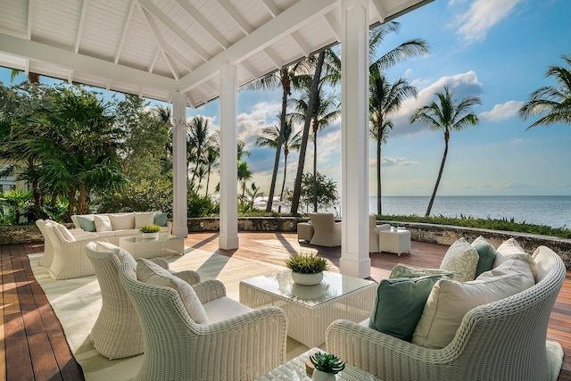 view of patio with a gazebo, a deck with water view, and outdoor lounge area