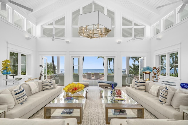 sunroom featuring a water view, wooden ceiling, ceiling fan with notable chandelier, and lofted ceiling with beams