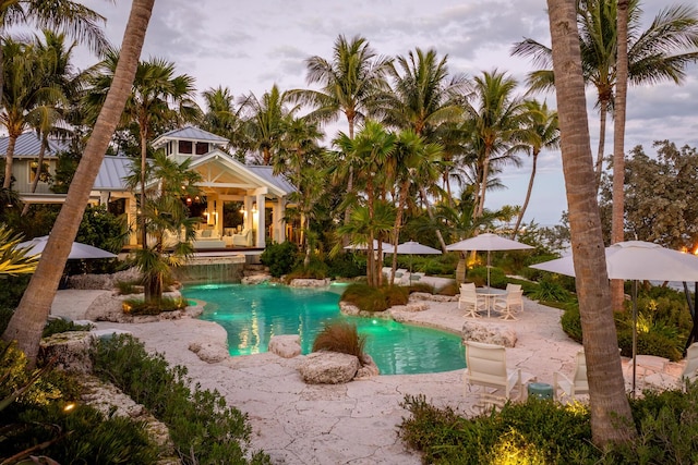 view of swimming pool with a patio area