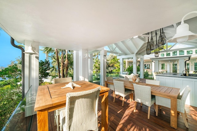 sunroom / solarium featuring lofted ceiling