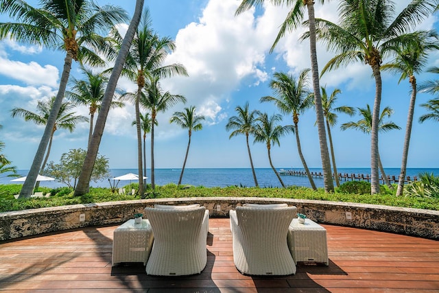 wooden terrace with a water view