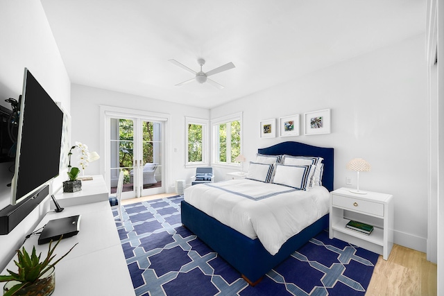 bedroom with french doors, ceiling fan, hardwood / wood-style floors, and access to outside