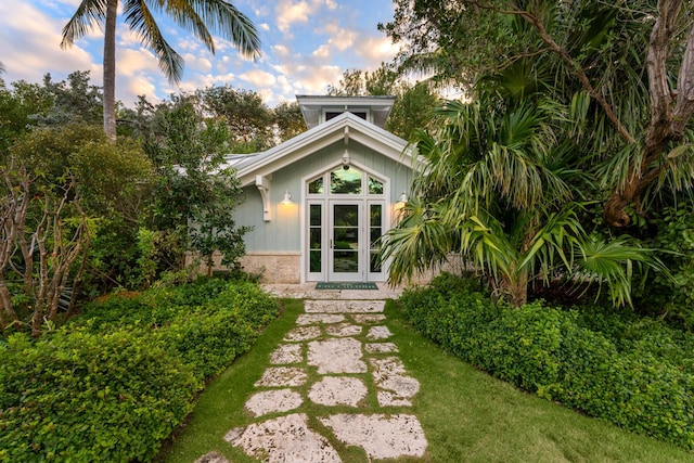 back house at dusk with french doors