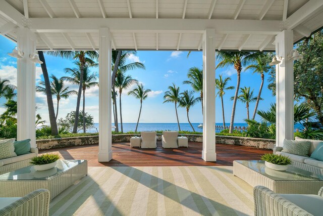 view of patio / terrace featuring a water view and an outdoor living space