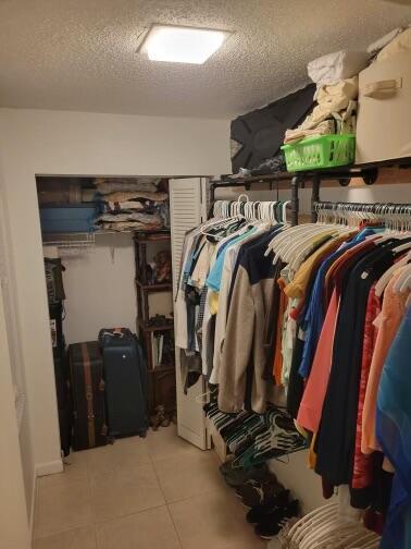 walk in closet featuring light tile patterned floors