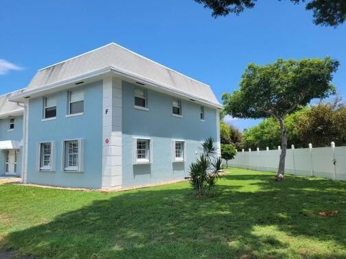 view of property exterior with a lawn