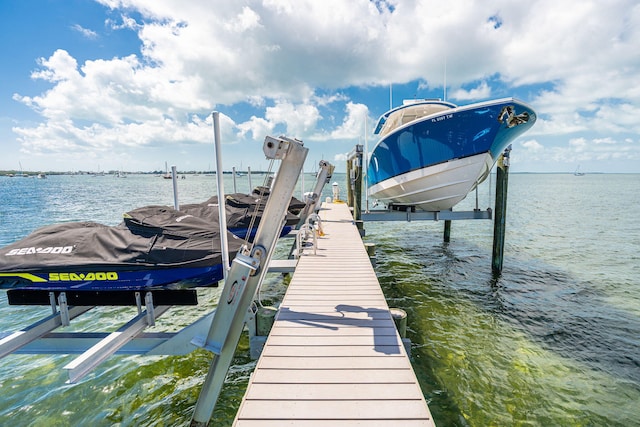 view of dock featuring a water view and boat lift