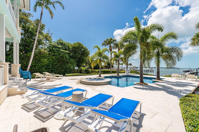 view of swimming pool featuring a patio area