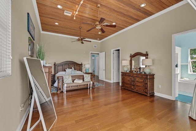 bedroom with visible vents, wood finished floors, wooden ceiling, and crown molding