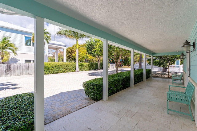 view of patio featuring fence