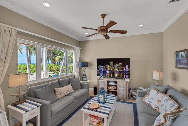 carpeted living room with recessed lighting, baseboards, a ceiling fan, and crown molding