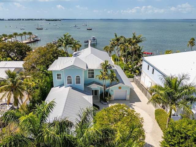 birds eye view of property with a water view