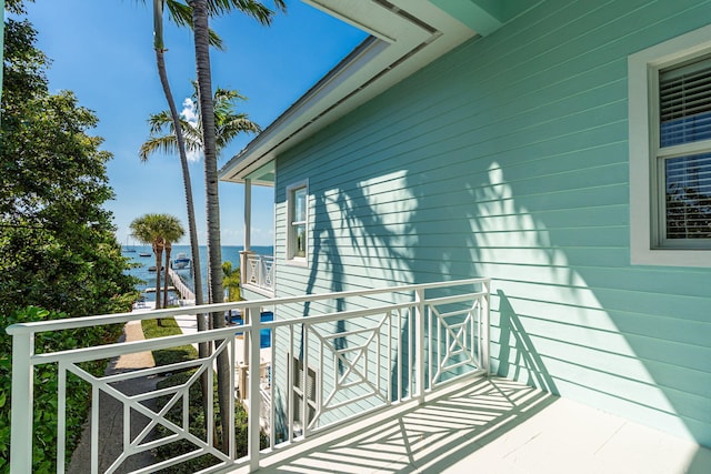 balcony featuring a water view