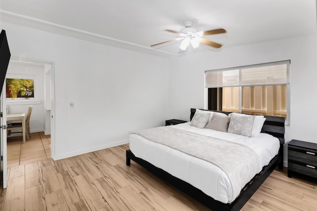 11554 5th Ave, Ocean, Marathon, FL 33050 - bedroom with light wood finished floors, ceiling fan, and baseboards