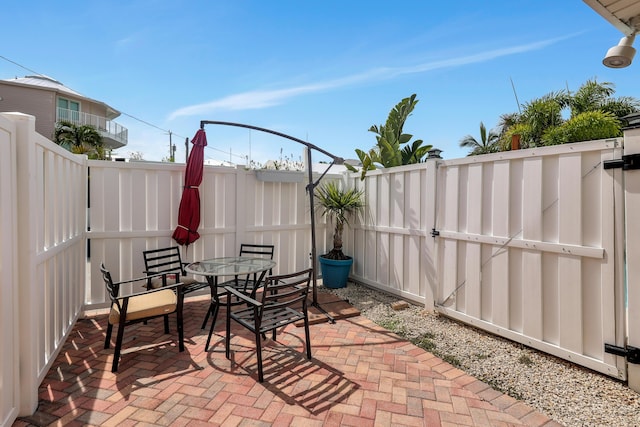 11554 5th Ave, Ocean, Marathon, FL 33050 - fenced backyard featuring a patio area and outdoor dining space