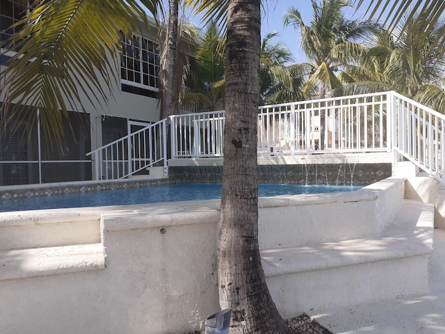 view of pool featuring pool water feature