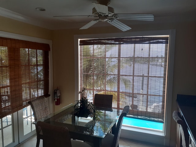 dining area featuring ceiling fan and light tile patterned flooring