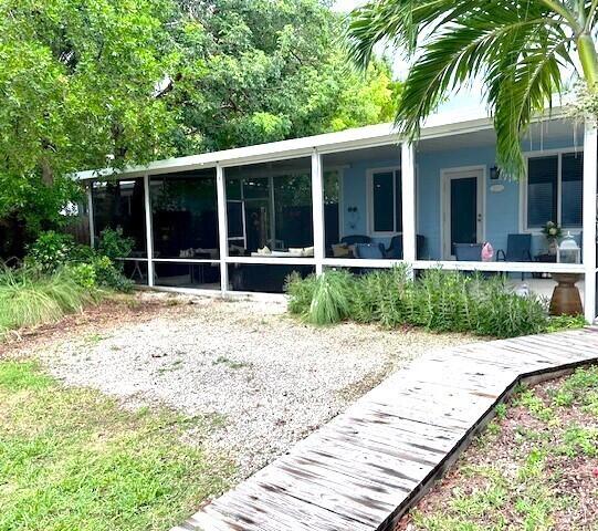 exterior space with a sunroom