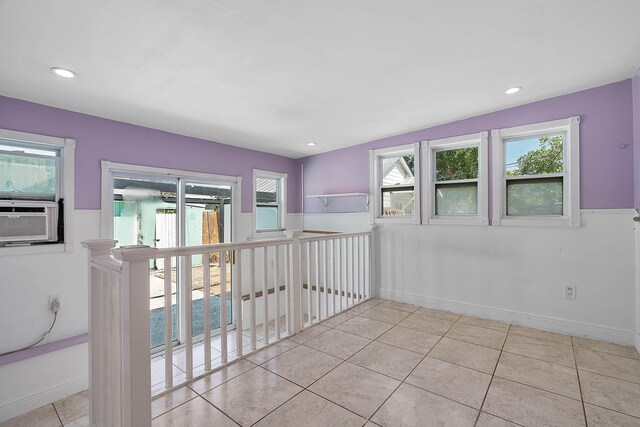 unfurnished bedroom with a closet, crown molding, baseboards, and wood finished floors