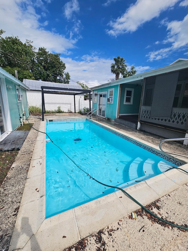 view of swimming pool featuring a fenced in pool