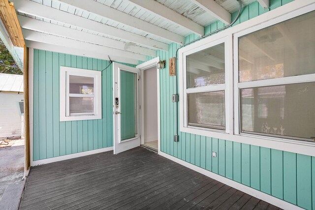 unfurnished bedroom featuring visible vents, a sink, crown molding, light wood finished floors, and baseboards