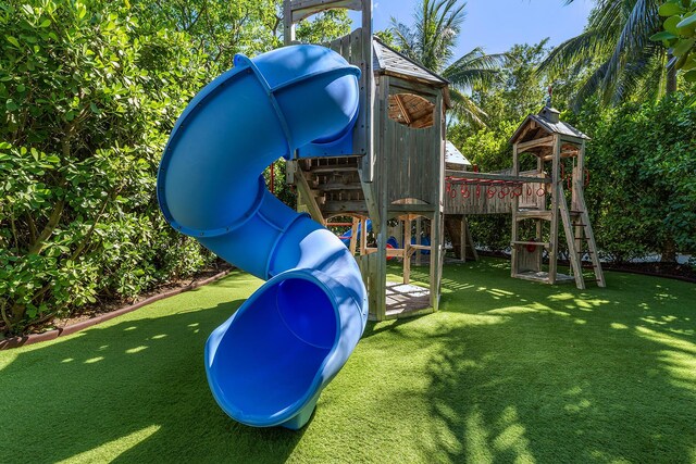 82779 Old Hwy Unit 21, Islamorada, FL 33036 - view of playground featuring a lawn