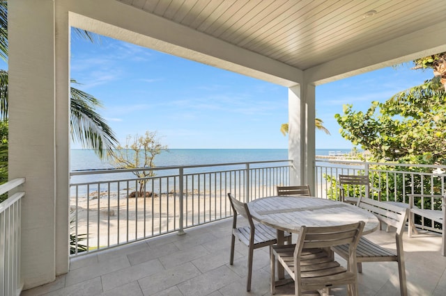 82779 Old Hwy Unit 21, Islamorada, FL 33036 - balcony featuring view of water and beach and outdoor dining area