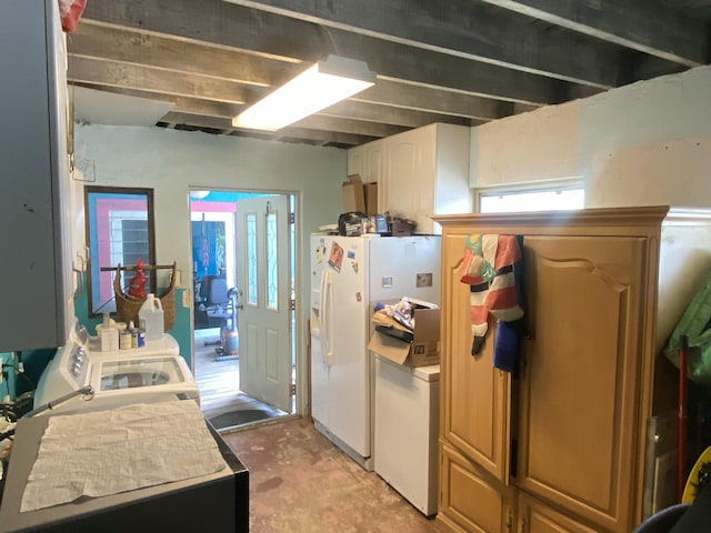 kitchen with concrete floors, white refrigerator with ice dispenser, and washer and clothes dryer