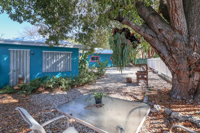 view of yard with fence and a patio