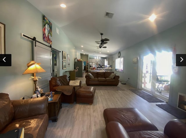 129 Lazy Ln, Key Largo, FL 33037 - living area with a barn door, a ceiling fan, lofted ceiling, light wood-style flooring, and recessed lighting