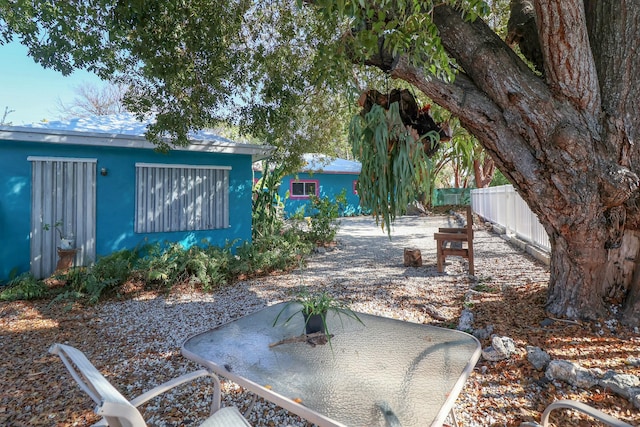 view of yard with fence and a patio area