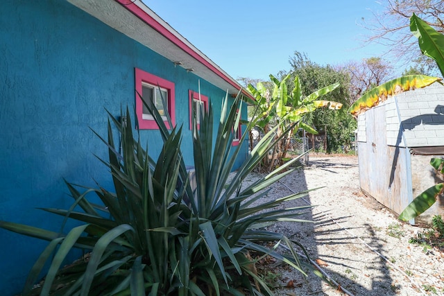 view of side of property with fence
