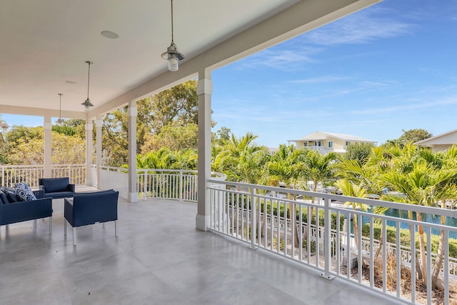 view of patio featuring a balcony and an outdoor hangout area