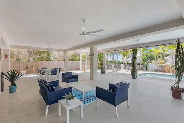 view of patio / terrace featuring an outdoor hangout area, outdoor dining area, fence, and a ceiling fan