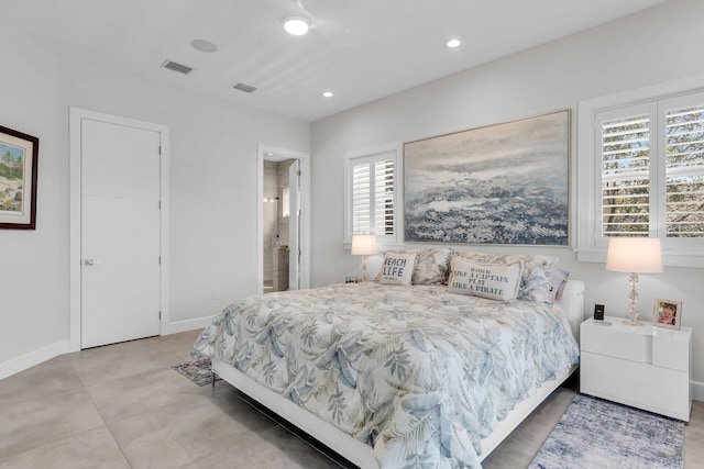 bedroom with baseboards, ensuite bathroom, visible vents, and recessed lighting