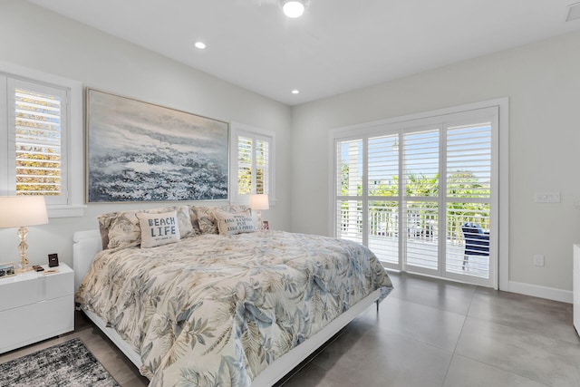 bedroom featuring baseboards, access to outside, and recessed lighting