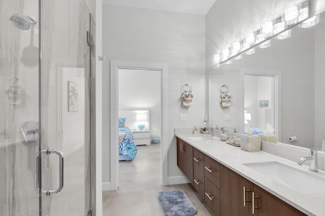 full bath featuring a sink, a shower stall, and ensuite bath