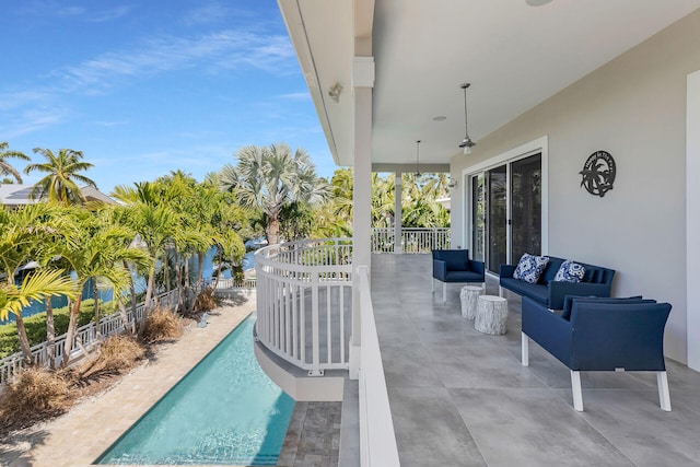 view of pool featuring a patio area, fence, an outdoor living space, and a fenced in pool