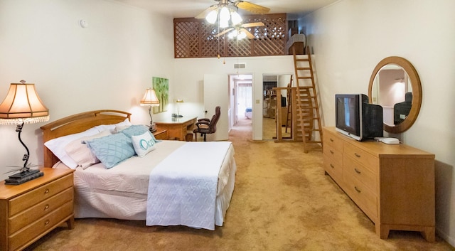 bedroom with a high ceiling and light carpet
