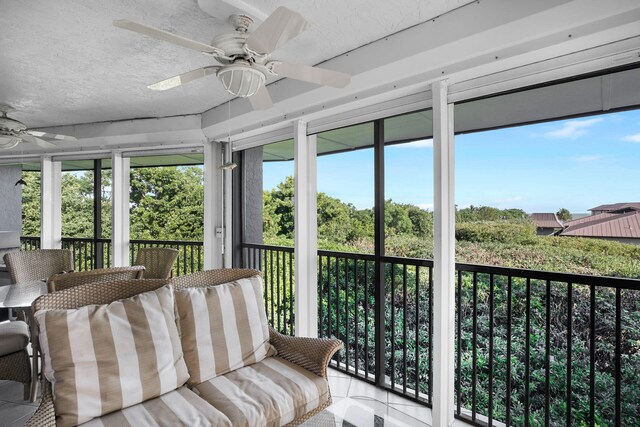 sunroom / solarium with ceiling fan
