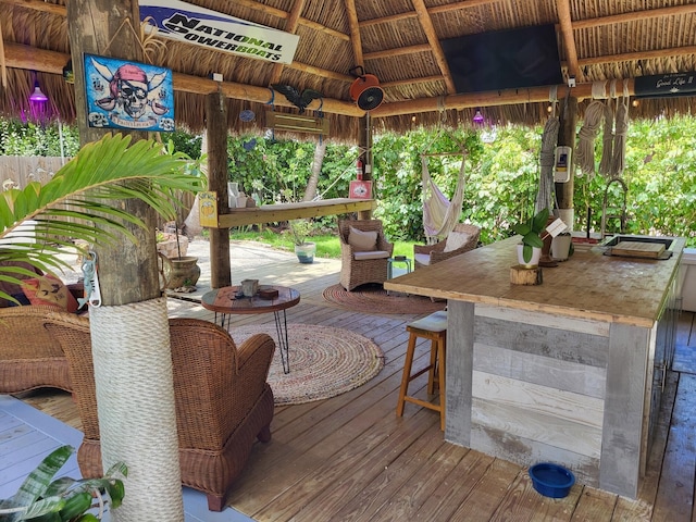 deck with a bar and a gazebo