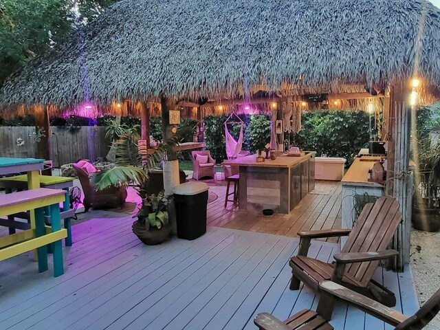 deck featuring a bar and a gazebo