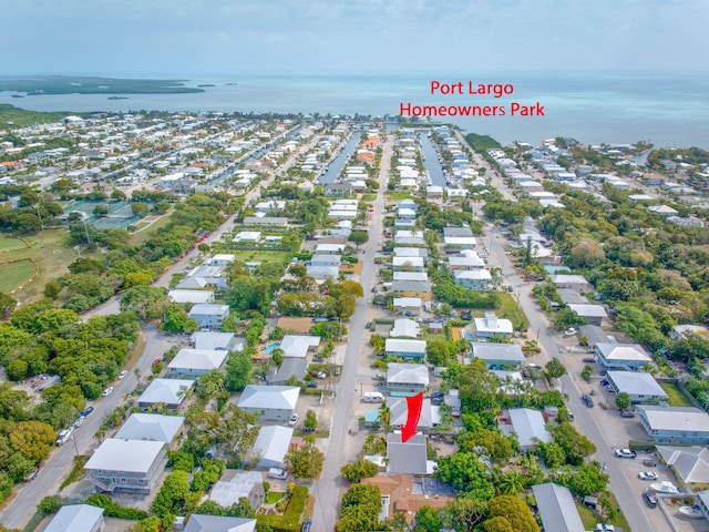 birds eye view of property featuring a water view and a residential view