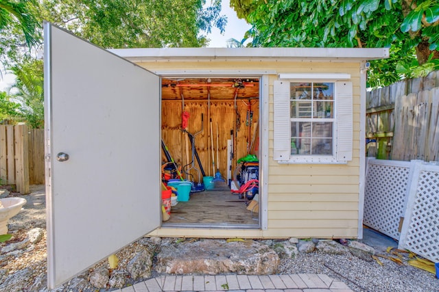 view of shed with fence