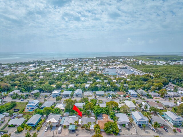 bird's eye view with a water view and a residential view