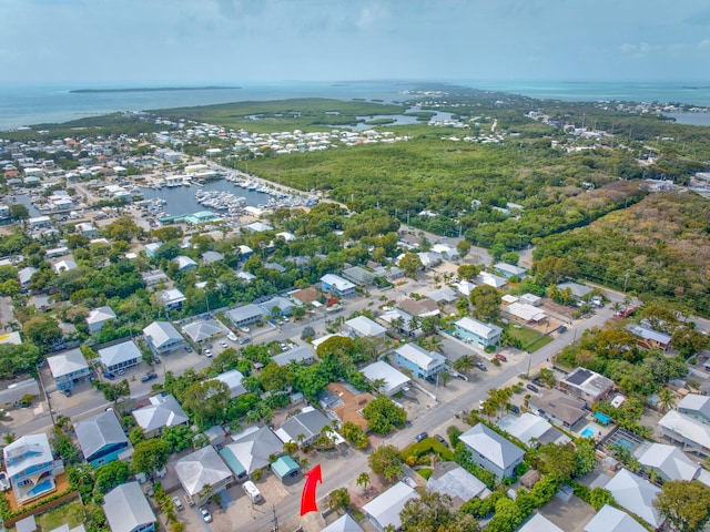 birds eye view of property with a water view and a residential view