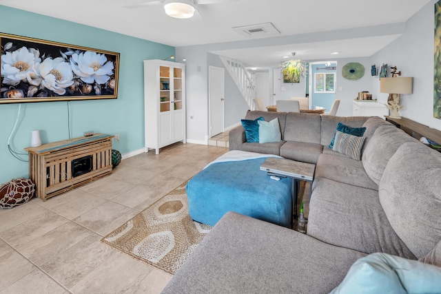 40 High Point Rd Unit C105, Tavernier, FL 33070 - tiled living room with stairway and a ceiling fan